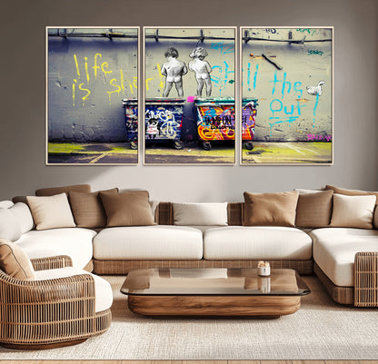 Graffiti-style canvas art with bold text and two naked figures over urban dumpsters, ideal for edgy or street-style decor.