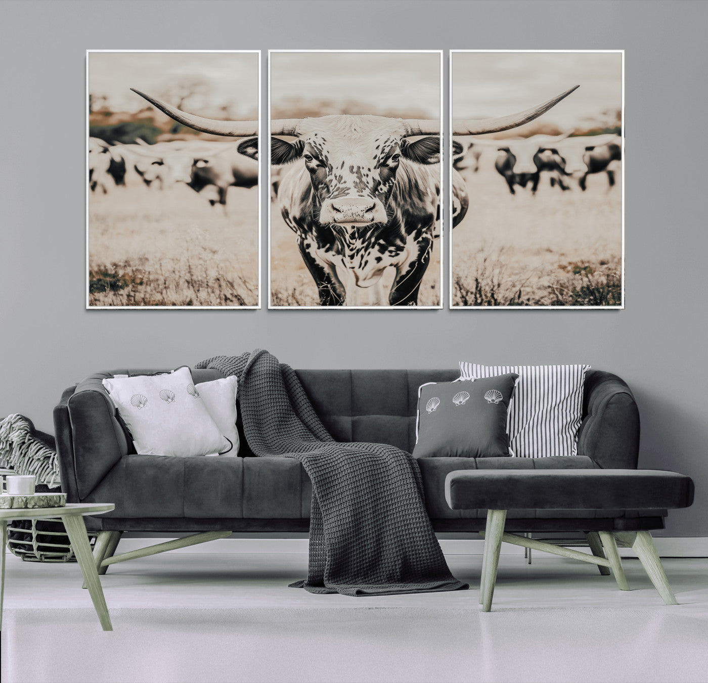 Canvas of a speckled Texas longhorn standing boldly in a field with a herd behind, perfect for rustic western or farmhouse wall decor.