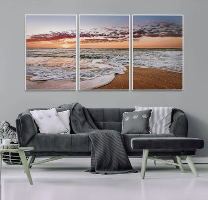 Canvas of a sunset over a foamy ocean shore with warm light and gentle waves, ideal for coastal or beach-themed home decor.