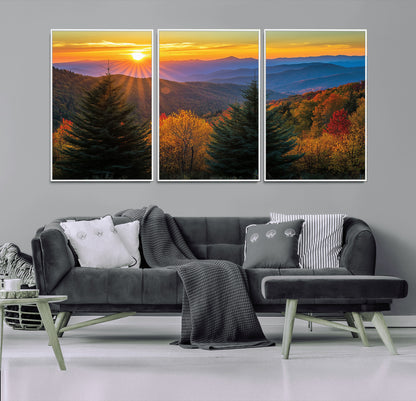 Vibrant sunset over autumn mountains with colorful trees and warm light, ideal for nature lovers or cabin-style wall decor.
