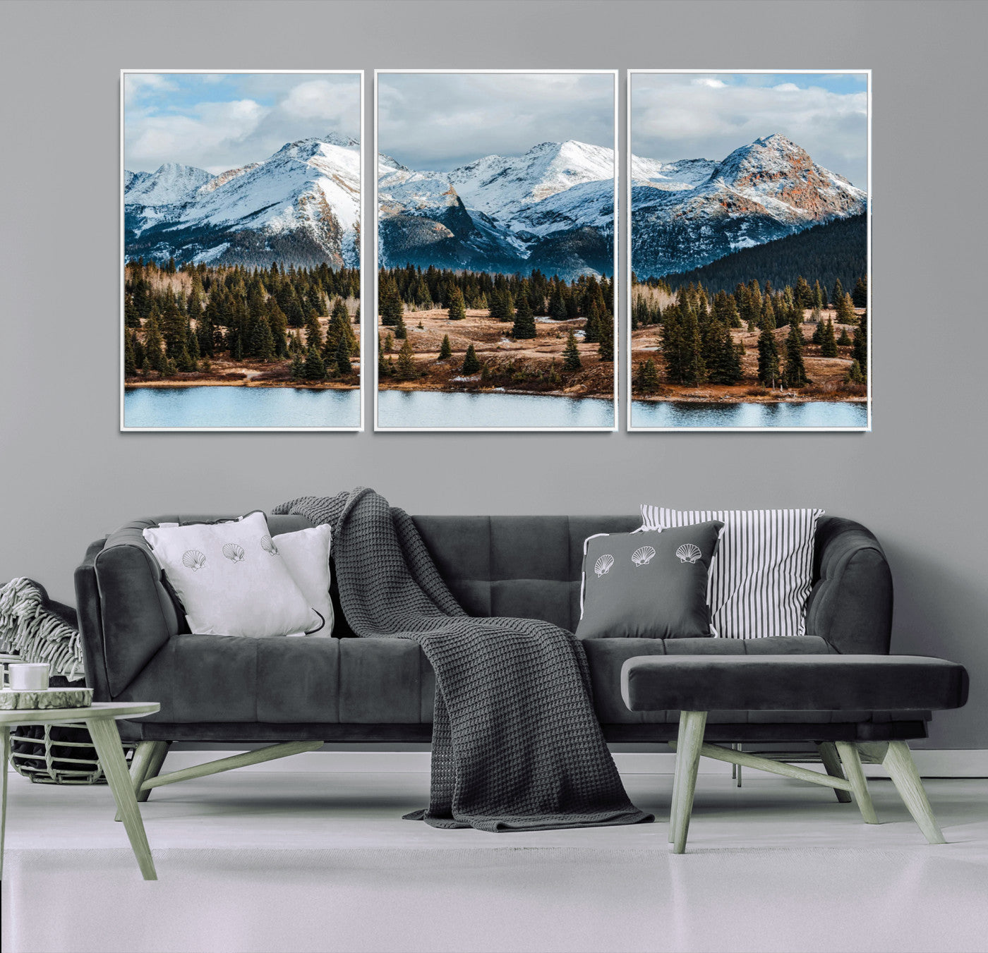 Framed canvas of snowy mountain peaks with pine forest and alpine lake, perfect for winter cabin or wilderness-inspired home decor.
