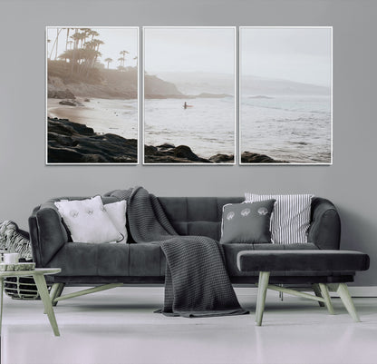 Framed canvas of a surfer in misty coastal tones at a foggy California beach, ideal for minimalist coastal beach or serene ocean-themed decor.