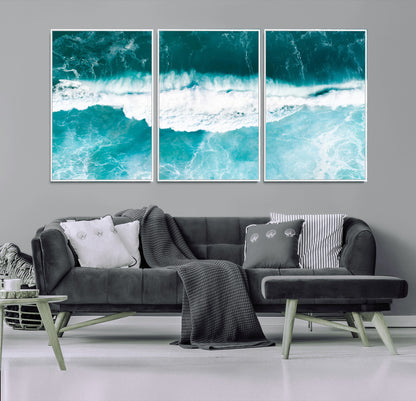 Aerial view of turquoise ocean waves crashing with white foam, perfect for tropical coastal or modern beach-style home decor.
