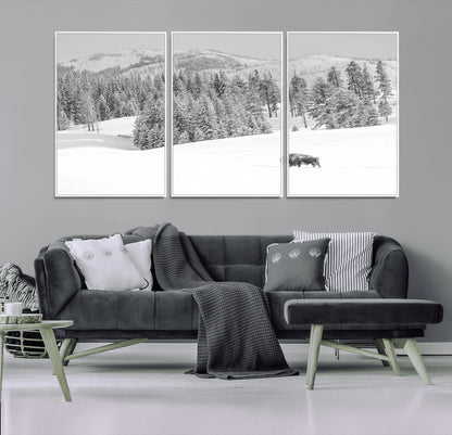Snowy bison walking through white forest landscape, ideal for monochrome winter or wilderness-style interior wall decoration.
