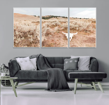 Rustic bull skull on dry sagebrush field under soft light, ideal for western minimal or desert prairie-style wall decoration.