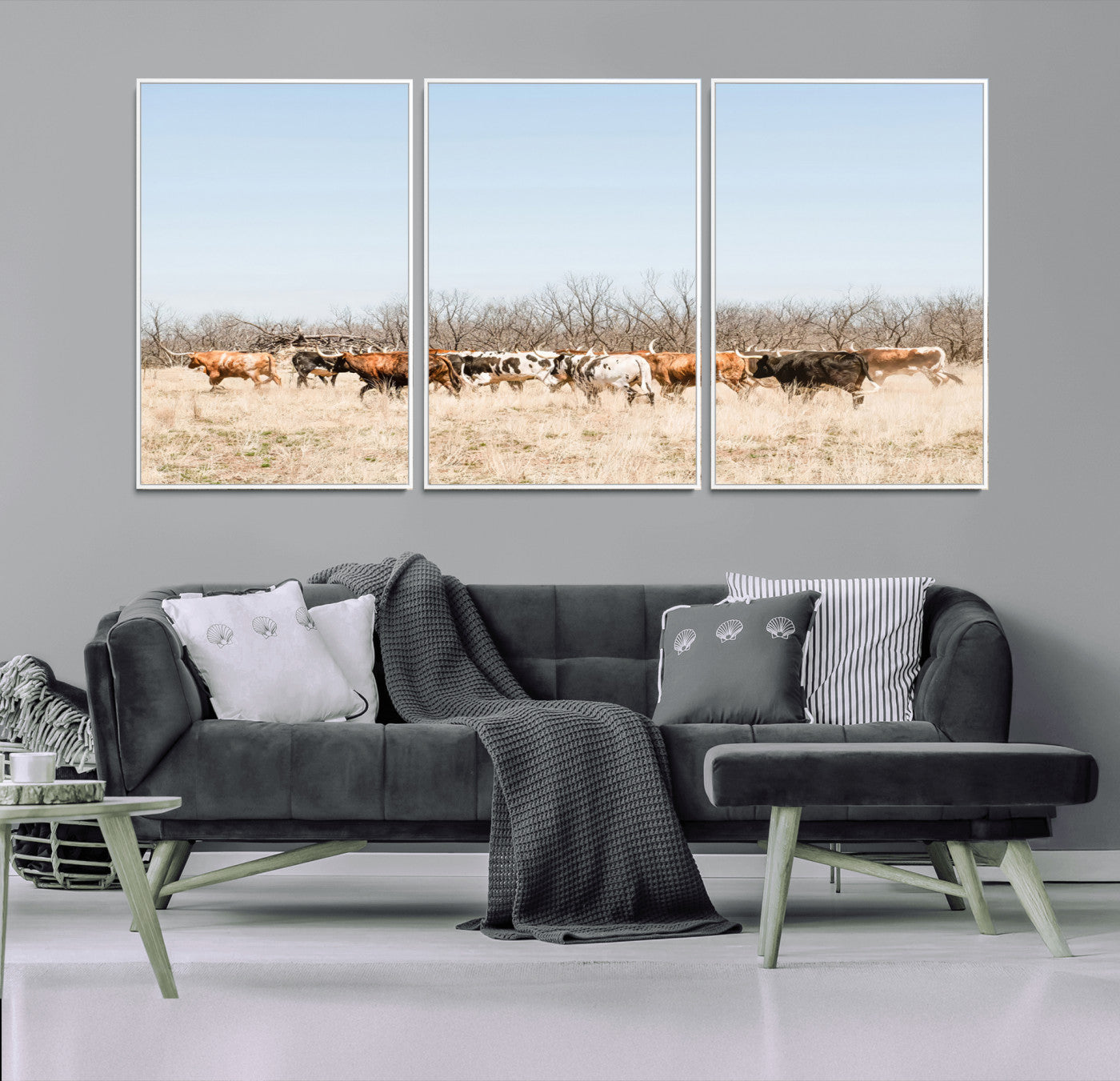 Framed wall art of Texas longhorn cattle walking through a dry, neutral-toned prairie, perfect for rustic farmhouse or western-themed home decor.