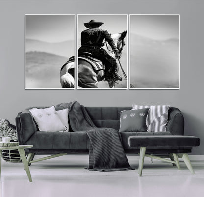 Black and white canvas of a cowboy on horseback with moody tones, perfect for rustic western or country-inspired home decor.