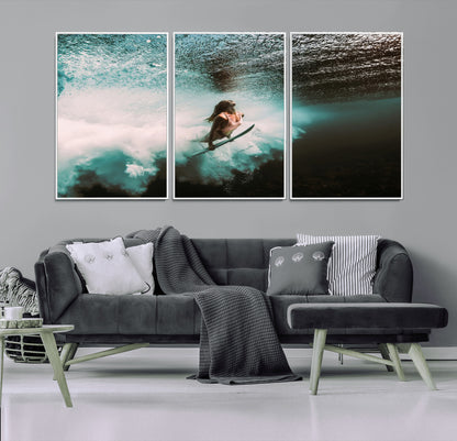 Vibrant underwater photo of a female surfer diving through turquoise waves, perfect for coastal boho or surf-inspired home decor.