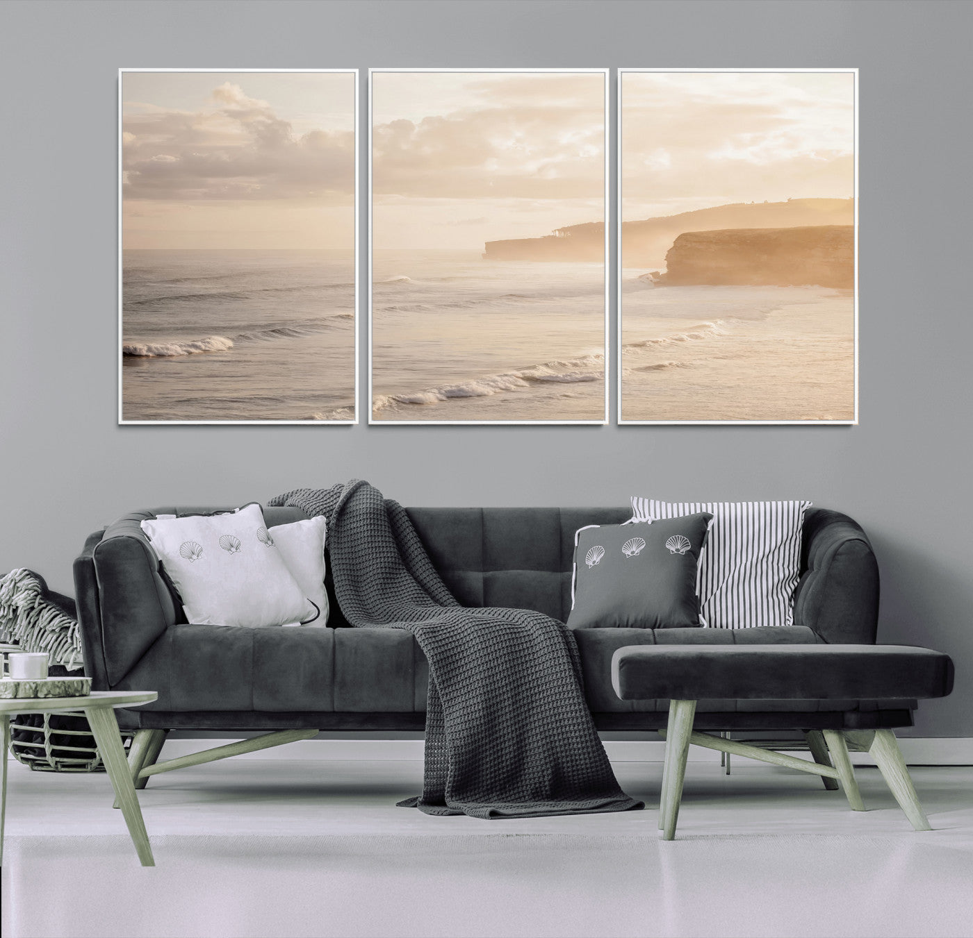 Golden hour seascape with misty cliffs and gentle waves rolling towards the shore, capturing a tranquil and warm coastal atmosphere.