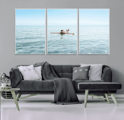 A peaceful minimalist scene of a person floating on crystal-clear water, surrounded by a vast open horizon, capturing relaxation and serenity in a tranquil aquatic setting.