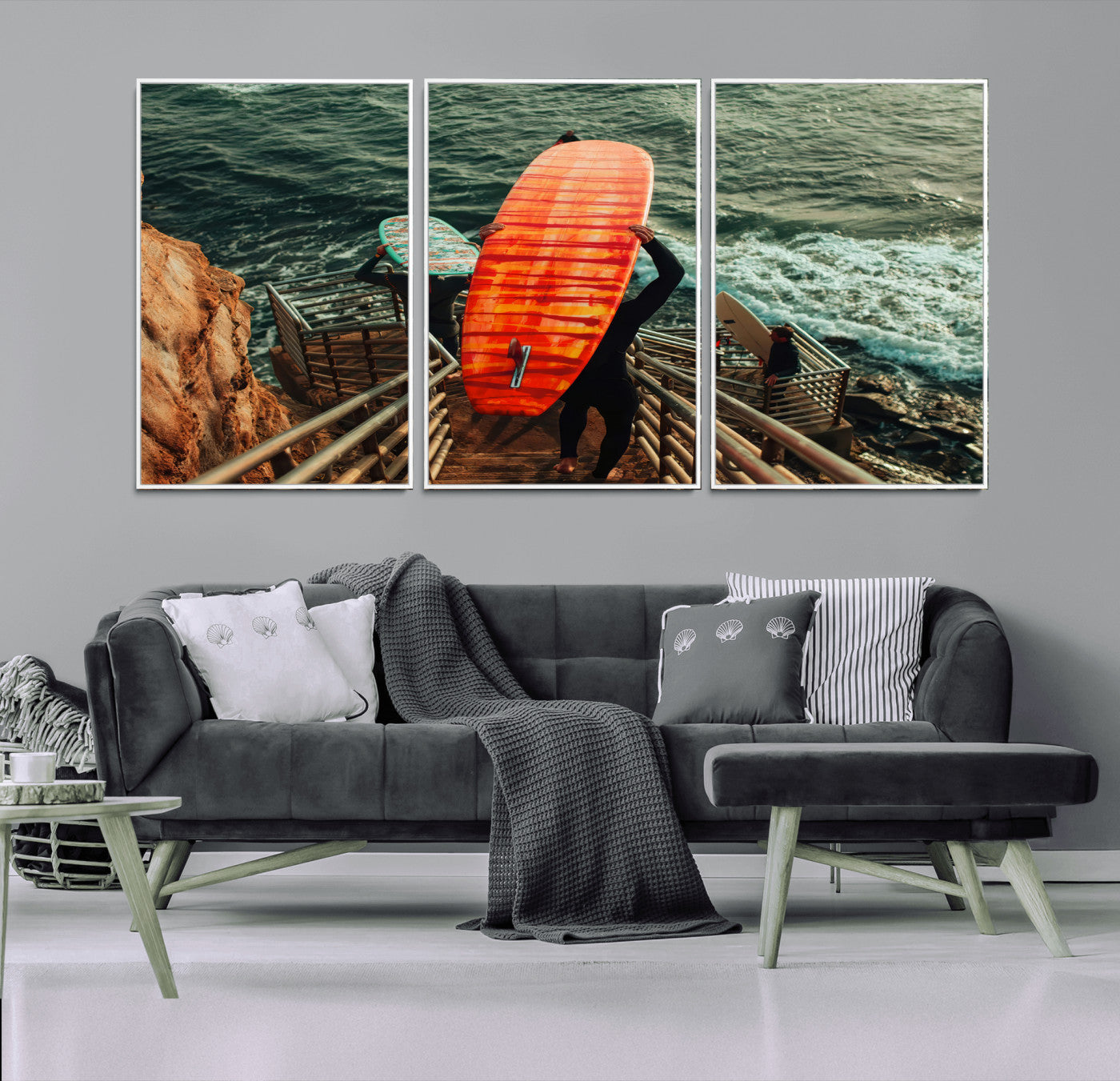 A surfer carrying a bold orange surfboard down a rugged staircase toward the ocean, bathed in golden hour light, capturing the energy of coastal adventure.