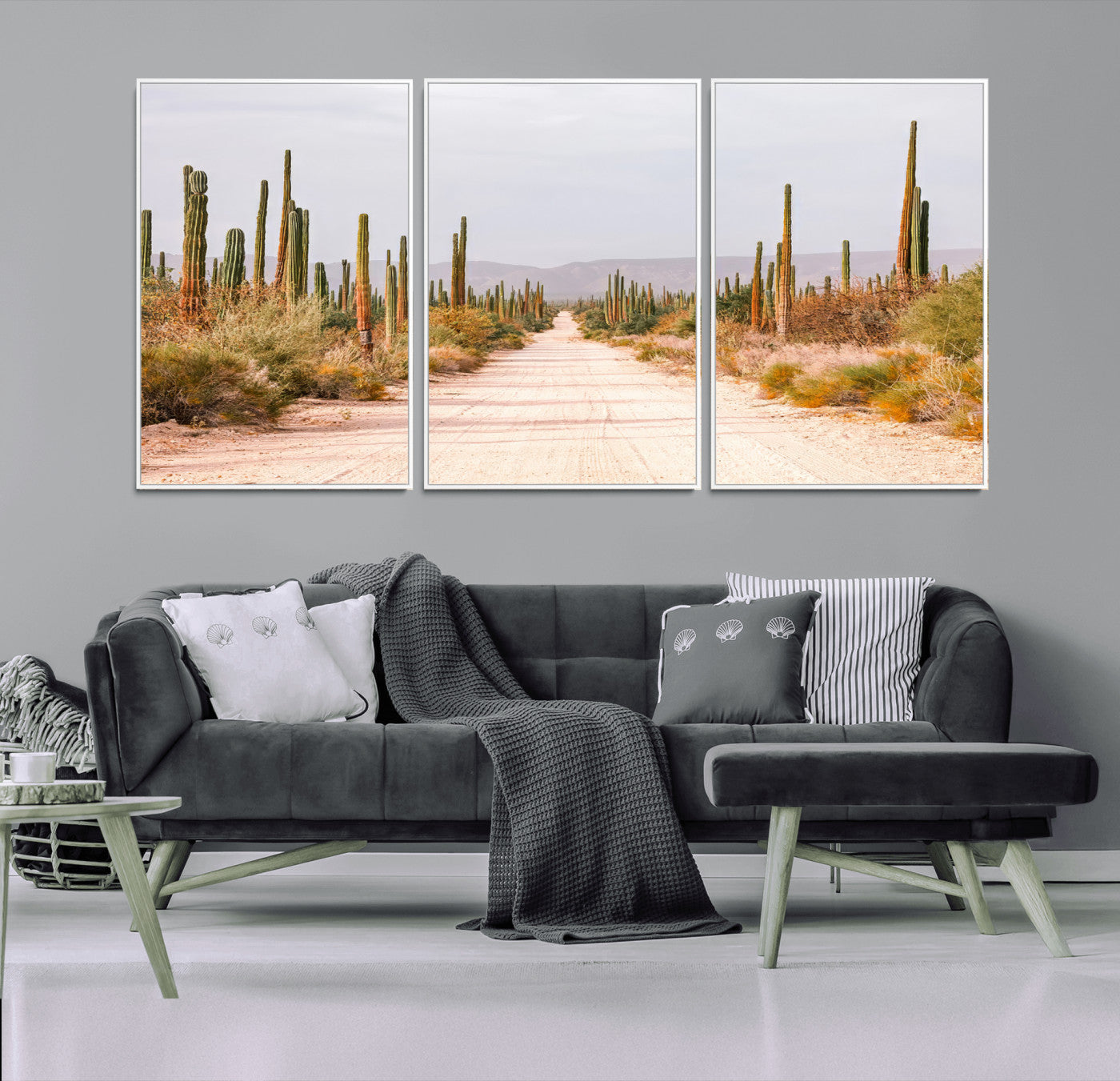 A desert road lined with saguaro cacti under a golden sky, creating a warm southwestern feel, perfect for boho or rustic decor.