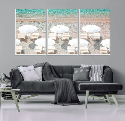 A bright beach scene with white umbrellas, pastel sand, and turquoise waters, creating a tranquil coastal vibe, perfect for beach house or summer decor.