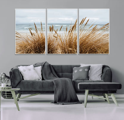 Canvas of golden beach grass swaying by the ocean under a soft cloudy sky, perfect for neutral-toned or coastal minimalist decor.