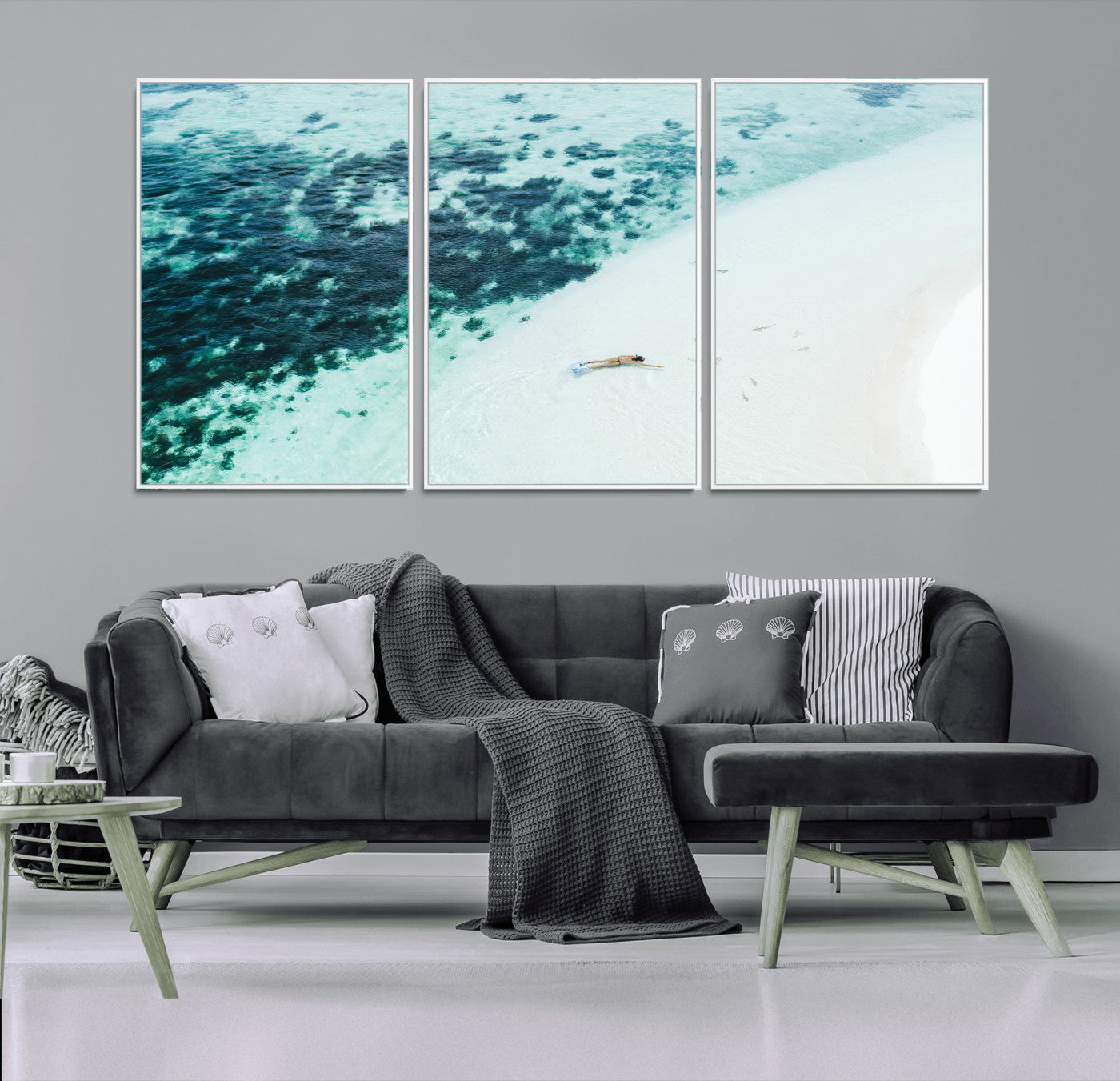 Canvas featuring an aerial view of a swimmer in shallow turquoise waters with coral patterns, ideal for tropical coastal home decor.