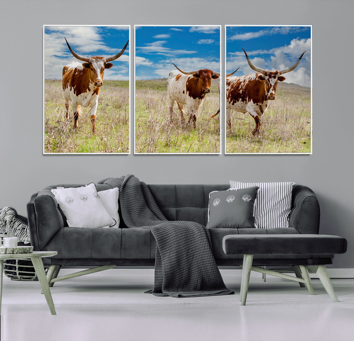Three Texas longhorn cattle standing in dry grass under a bright blue sky, ideal for farmhouse or western rustic home decor.
