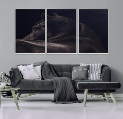Close-up of a black horse with dramatic lighting on a dark background, perfect for rustic or masculine home decor.