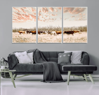 Cattle herd in a soft-toned field under a pastel pink sky, creating a peaceful rustic feel, perfect for farmhouse or western-themed spaces.