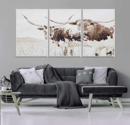 Two longhorn cows standing in a sepia-toned pasture with soft light, ideal for rustic or farmhouse-themed neutral wall decor.