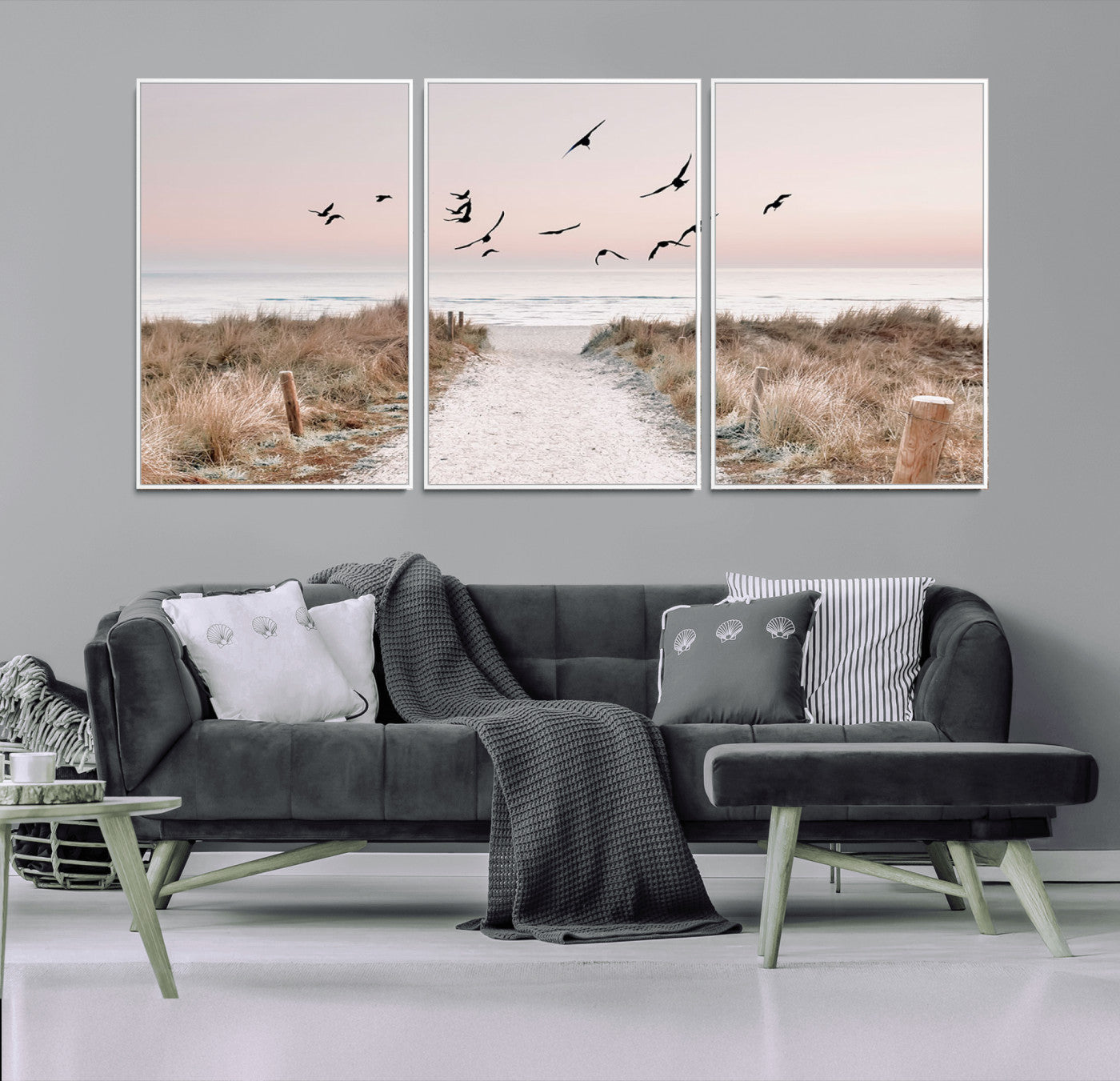 A peaceful coastal pathway leading to the ocean, with birds flying across a soft pastel sky, creating a calm and scenic beach atmosphere.