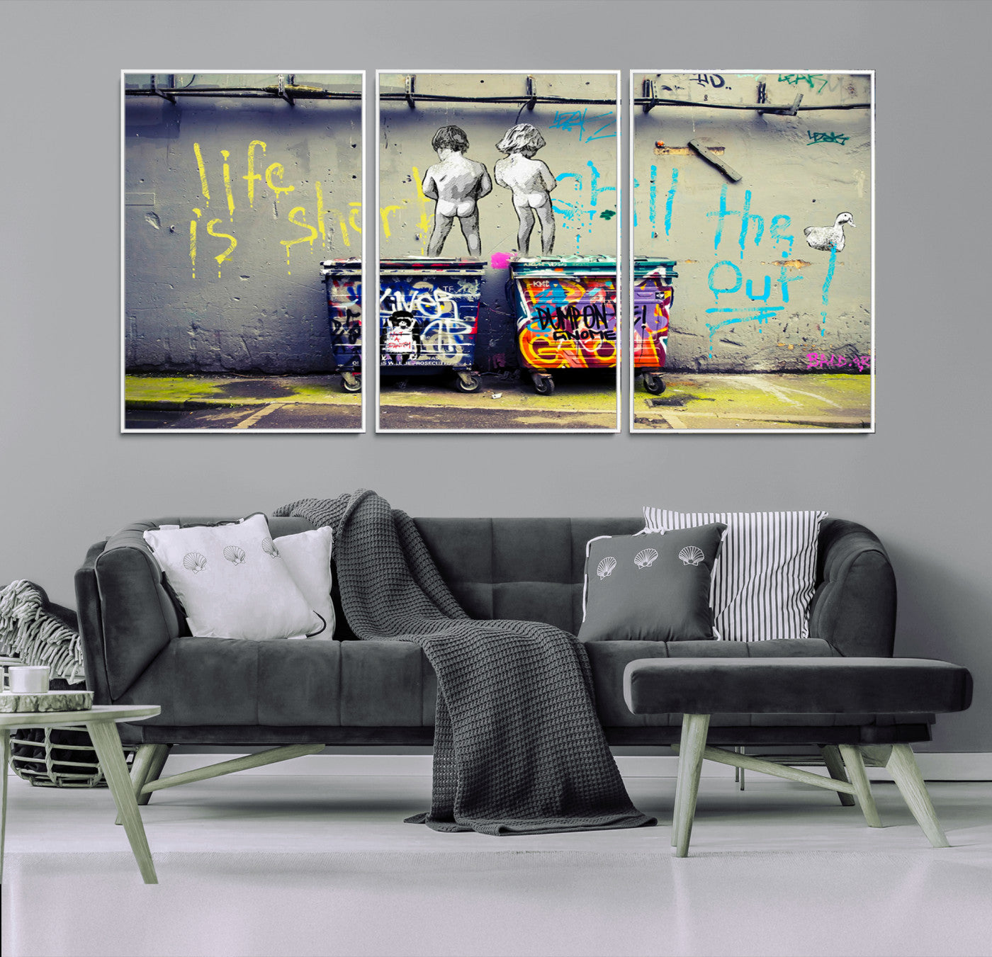 Graffiti-style canvas art with bold text and two naked figures over urban dumpsters, ideal for edgy or street-style decor.