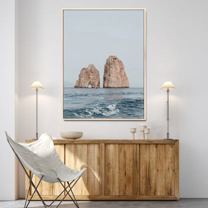 Serene photograph of the Faraglioni rocks in Capri with calm blue waters, perfect for Mediterranean coastal or minimalist travel-themed decor.