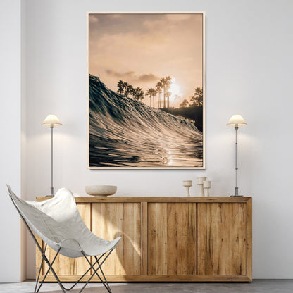 Golden sunset view of an ocean wave curling near palm trees, radiating warm tones perfect for coastal or tropical-themed decor.