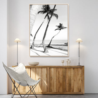 Black and white wall art of palm trees and a hammock on a beach, ideal for coastal minimalist or tropical-themed decor.