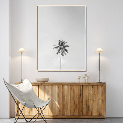 Canvas of a single palm tree in black and white with minimalist sky, ideal for modern coastal minimalist or tropical-inspired home decor.