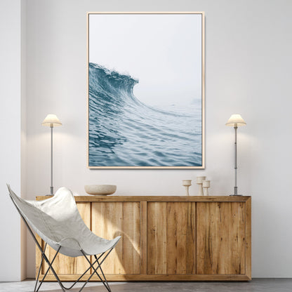 A single ocean wave curling in soft blue tones under a misty sky, ideal for coastal or minimalist home wall decor.