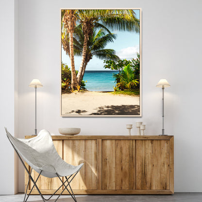 Tropical beach with palm trees, blue ocean, and clear sky, perfect for coastal or beach-themed wall decor in sunny living spaces.