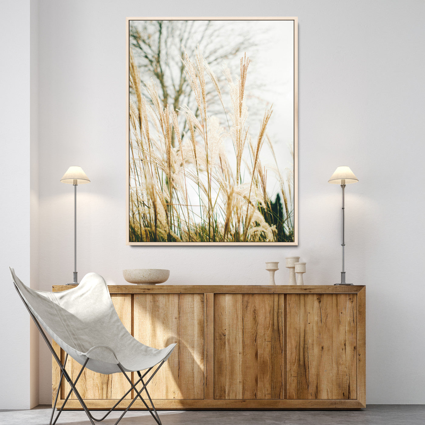 Soft beige pampas grass swaying in the breeze against a muted sky, creating a tranquil and minimalist botanical aesthetic.