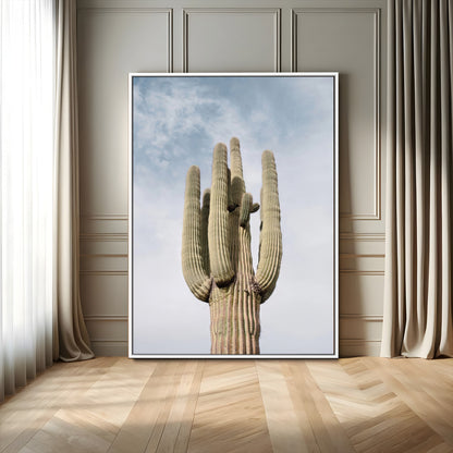 Vertical photo of a tall saguaro cactus against a soft sky, ideal for earthy or Southwestern home decor with warm neutral tones.
