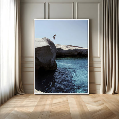 Canvas of a cliff diver above turquoise waters and rocky coastline under clear sky, ideal for adventurous minimalist or coastal home decor.