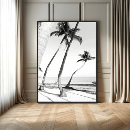 Black and white wall art of palm trees and a hammock on a beach, ideal for coastal minimalist or tropical-themed decor.