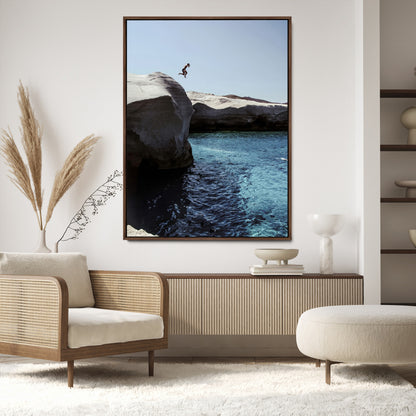 Canvas of a cliff diver above turquoise waters and rocky coastline under clear sky, ideal for adventurous minimalist or coastal home decor.