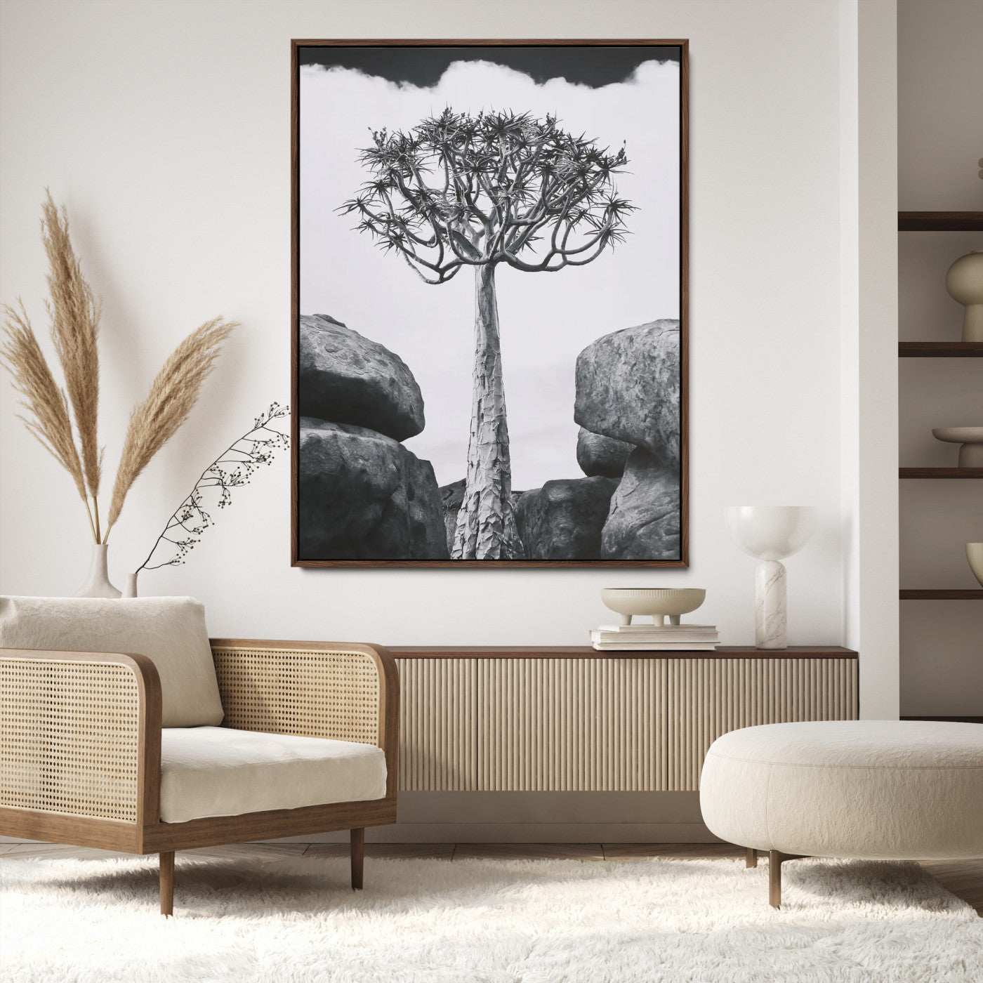 Tall desert tree in black and white, standing between large rocks, perfect for bold and minimalist nature-themed interior spaces.