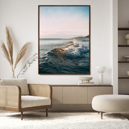 Close-up of ocean waves rolling gently toward the shore at sunset, creating a peaceful and minimalist coastal scene.