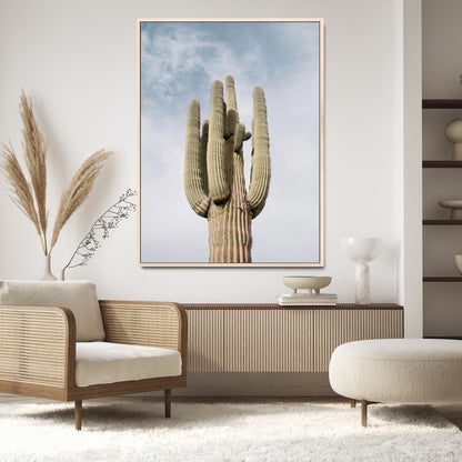 Vertical photo of a tall saguaro cactus against a soft sky, ideal for earthy or Southwestern home decor with warm neutral tones.