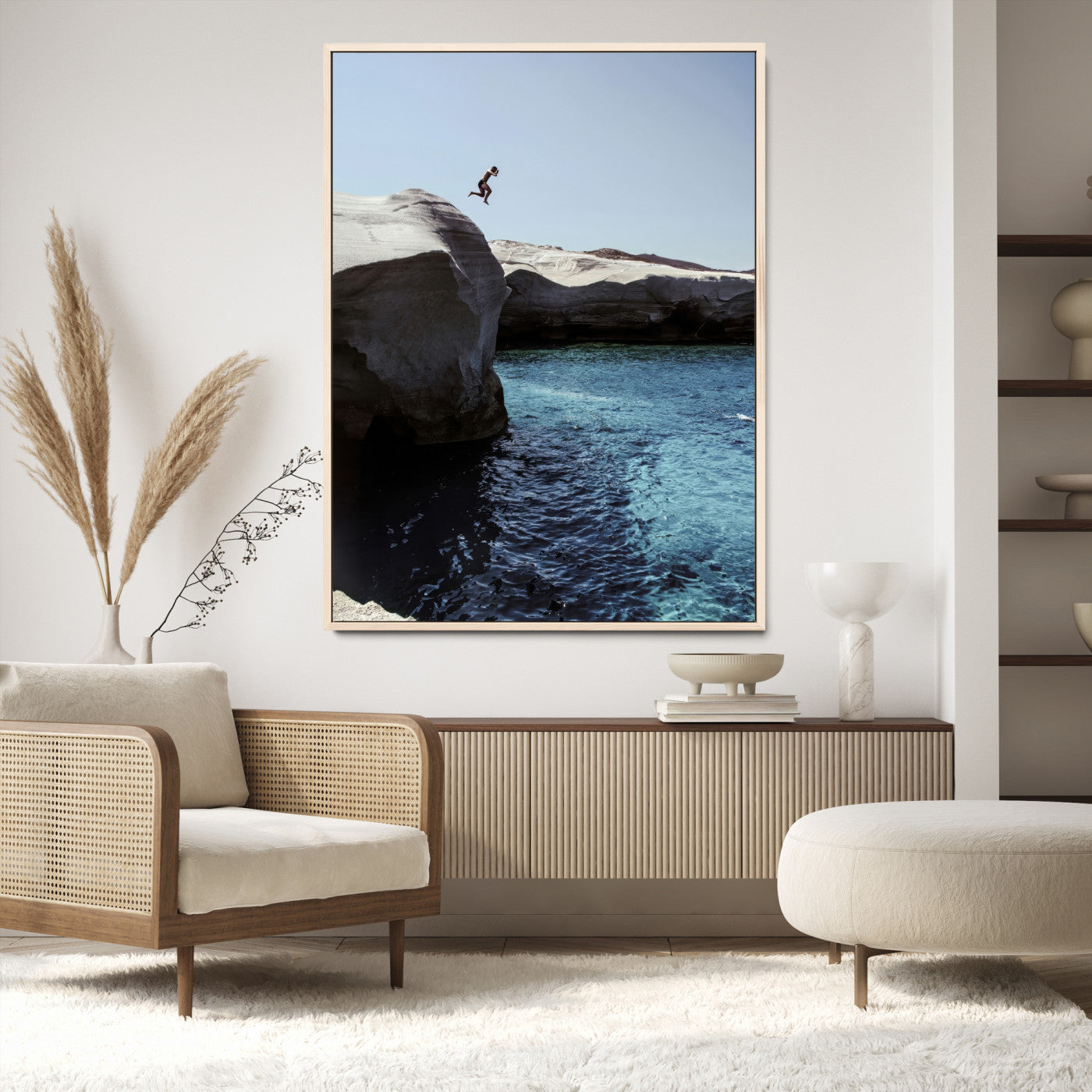 Canvas of a cliff diver above turquoise waters and rocky coastline under clear sky, ideal for adventurous minimalist or coastal home decor.