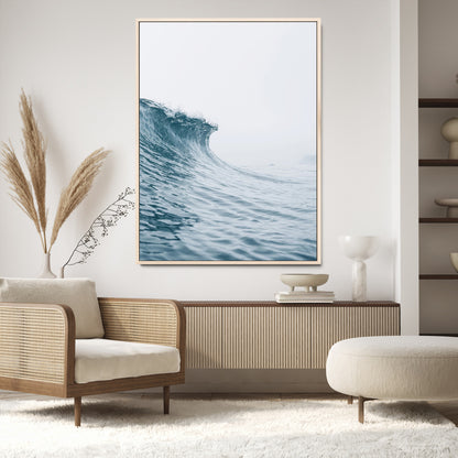 A single ocean wave curling in soft blue tones under a misty sky, ideal for coastal or minimalist home wall decor.