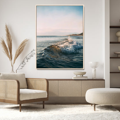 Close-up of ocean waves rolling gently toward the shore at sunset, creating a peaceful and minimalist coastal scene.