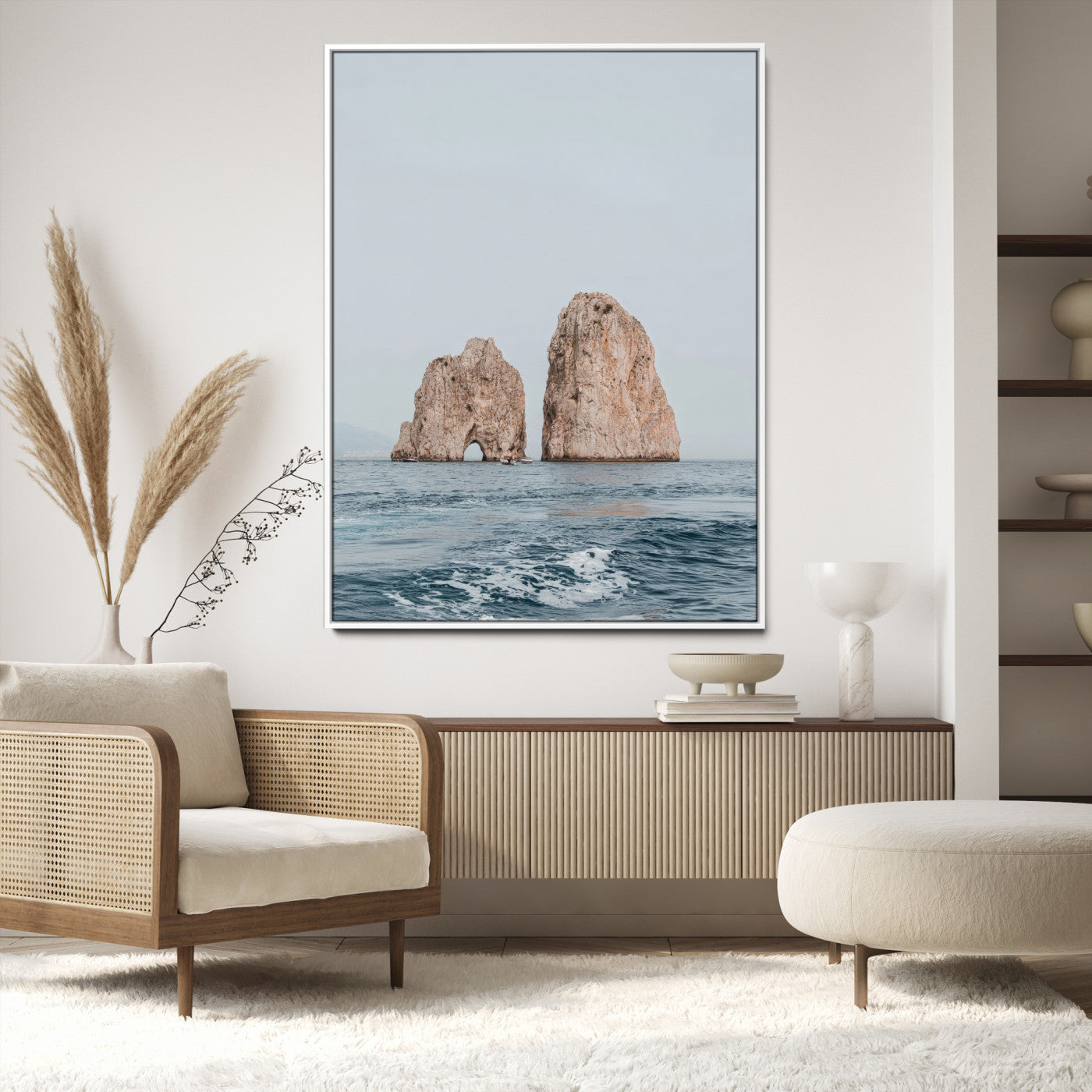 Serene photograph of the Faraglioni rocks in Capri with calm blue waters, perfect for Mediterranean coastal or minimalist travel-themed decor.
