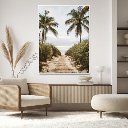 Canvas wall art of a tropical beach path with palm trees and dune grass, ideal for coastal entryways or tropical-inspired home decor.