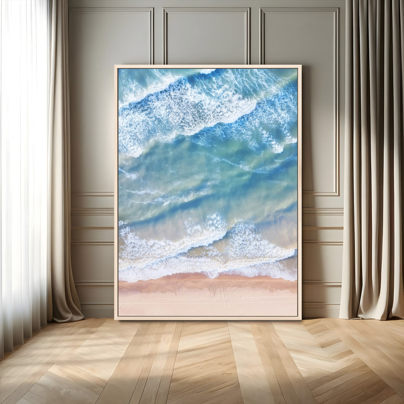 Aerial photo of soft blue waves meeting sandy shore, perfect for modern coastal or beach-themed decor with a light and tranquil aesthetic.