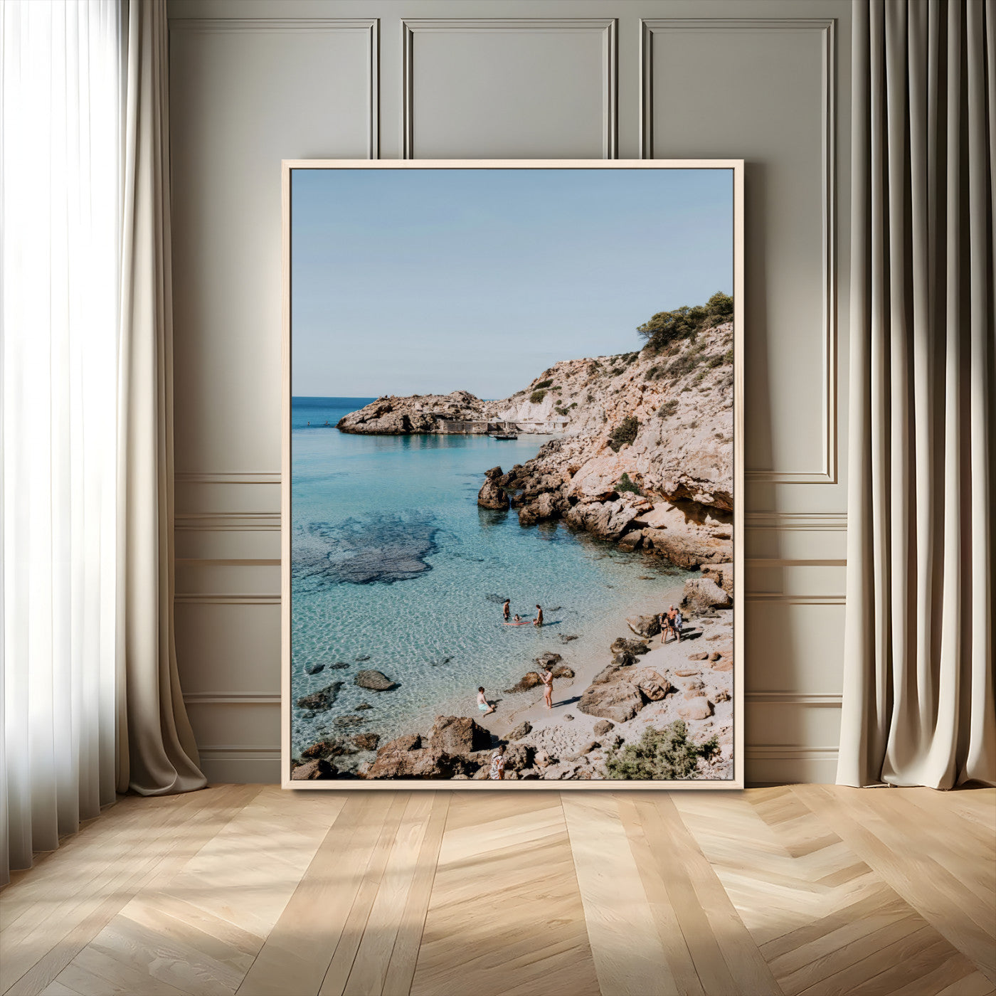 A vibrant coastal photo of a rocky Mediterranean cove with turquoise waters and beachgoers, ideal for boho coastal or summer-inspired interiors.