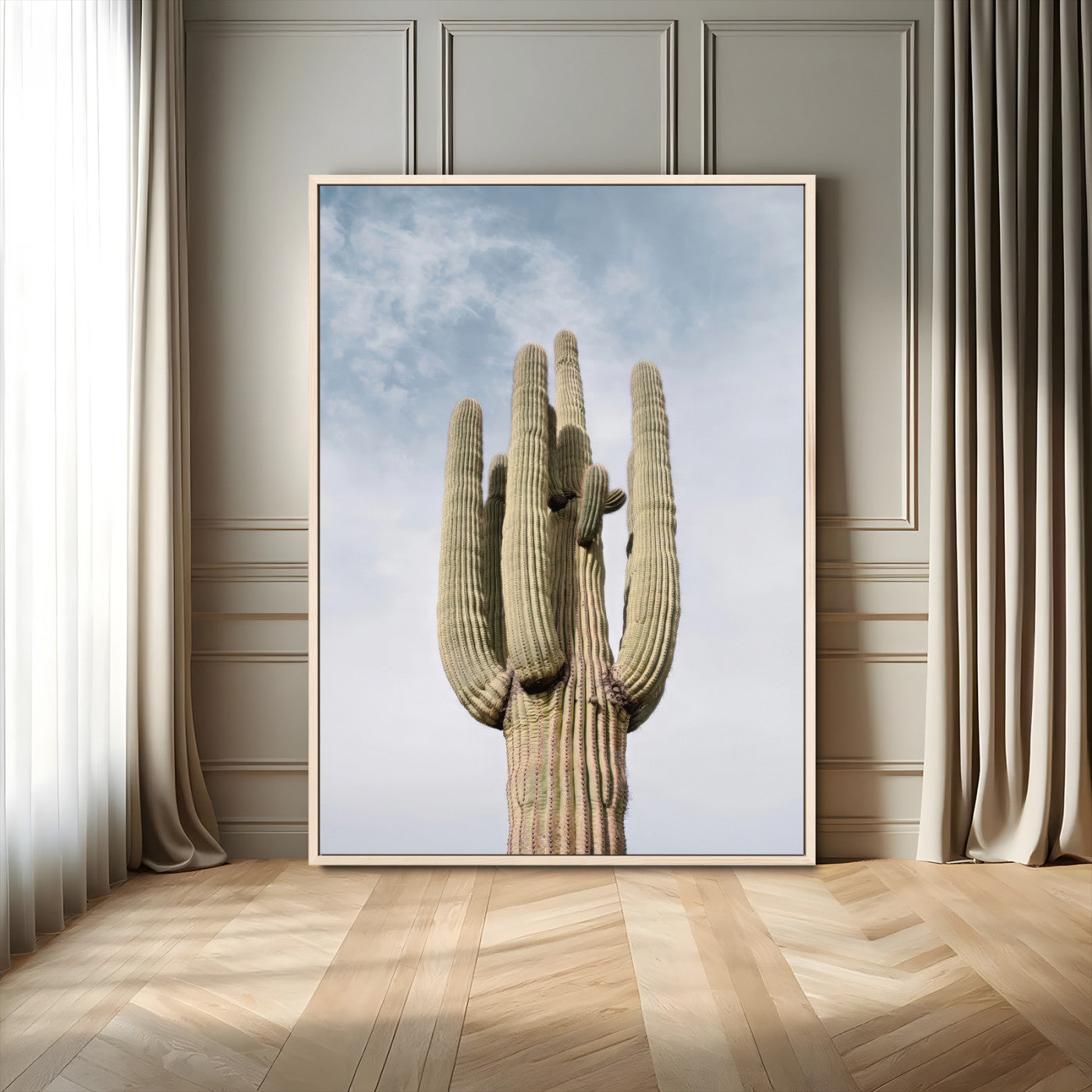 Vertical photo of a tall saguaro cactus against a soft sky, ideal for earthy or Southwestern home decor with warm neutral tones.