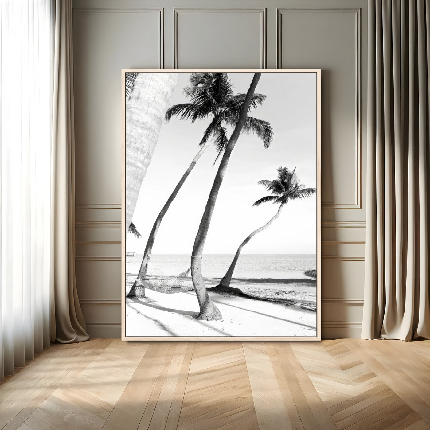 Black and white wall art of palm trees and a hammock on a beach, ideal for coastal minimalist or tropical-themed decor.