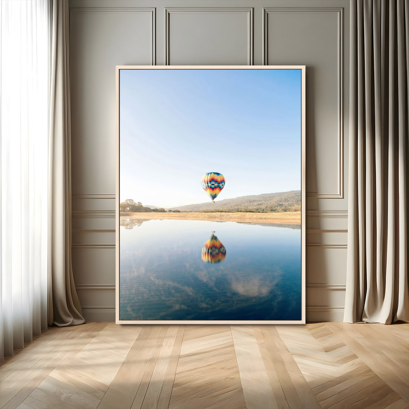 Canvas of a hot air balloon floating above a calm lake with soft reflections and vibrant sky, ideal for modern minimalist or adventure-themed home decor.