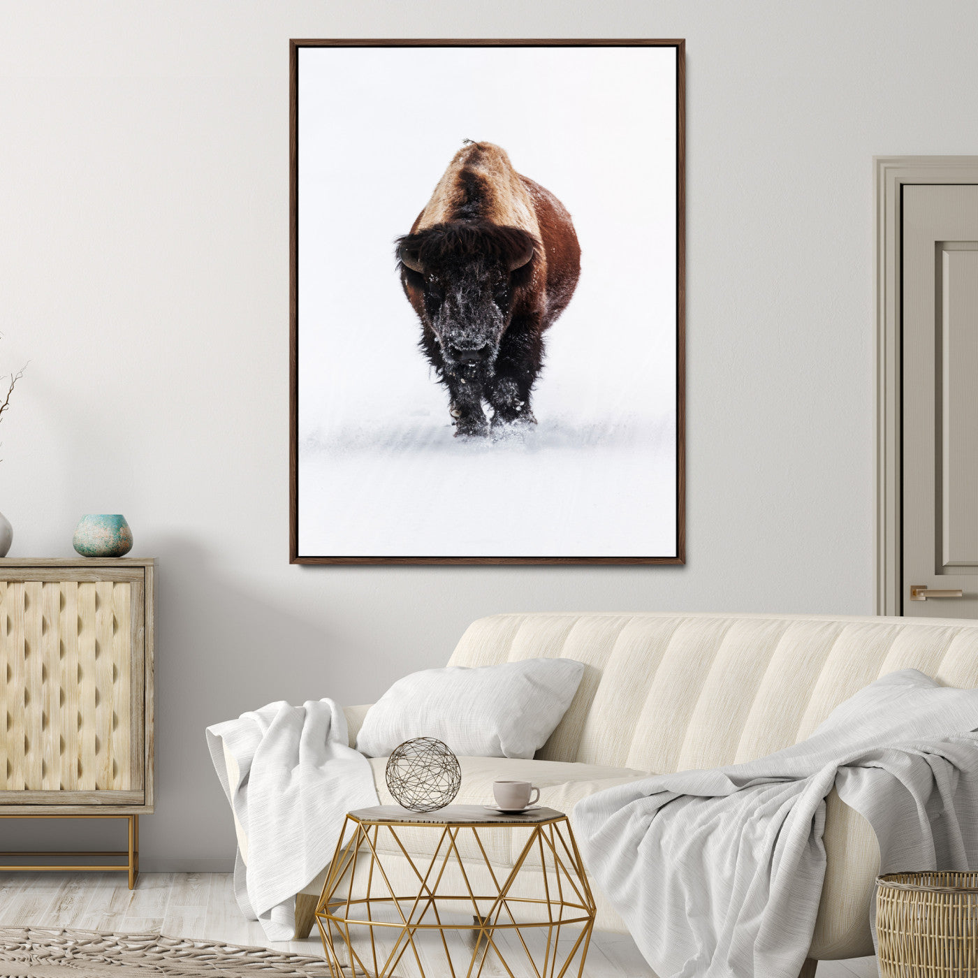Front view of a strong bison walking in deep snow, isolated white background, perfect for rustic or lodge-style home decor.